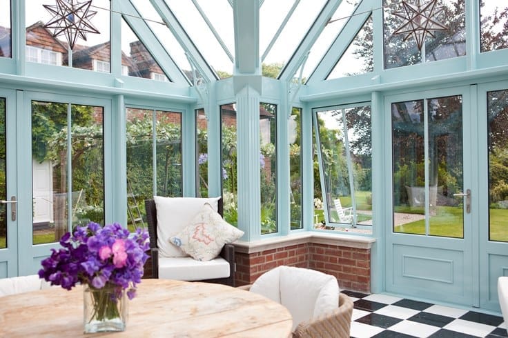 Blue conservatory with chequerboard flooring