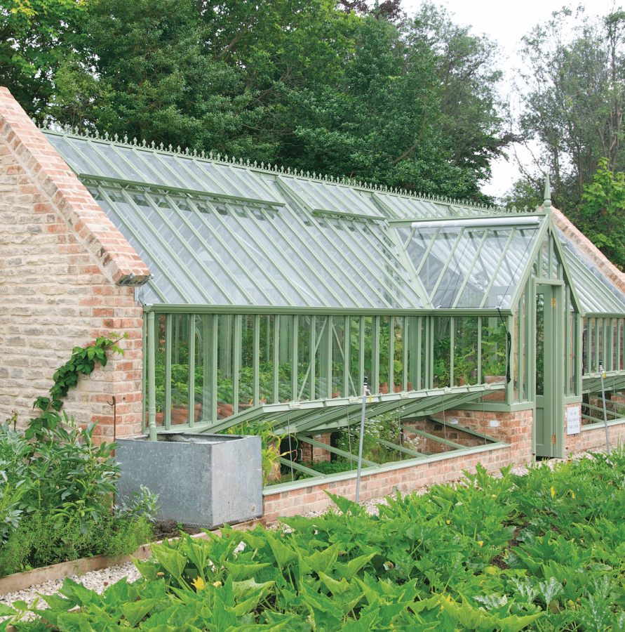 Greenhouse with gable ends attached to walls