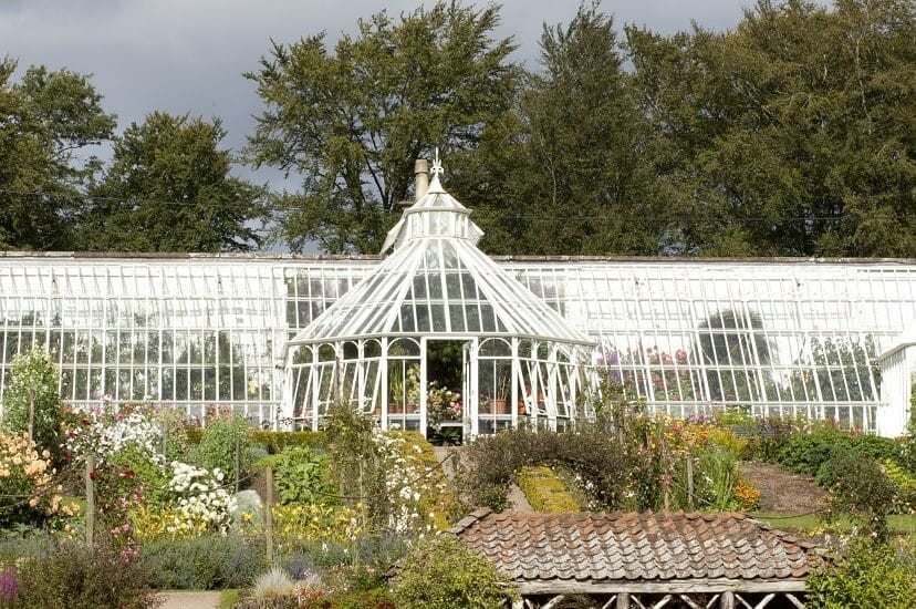 Wooden replication in Aluminium lean-to greenhouse