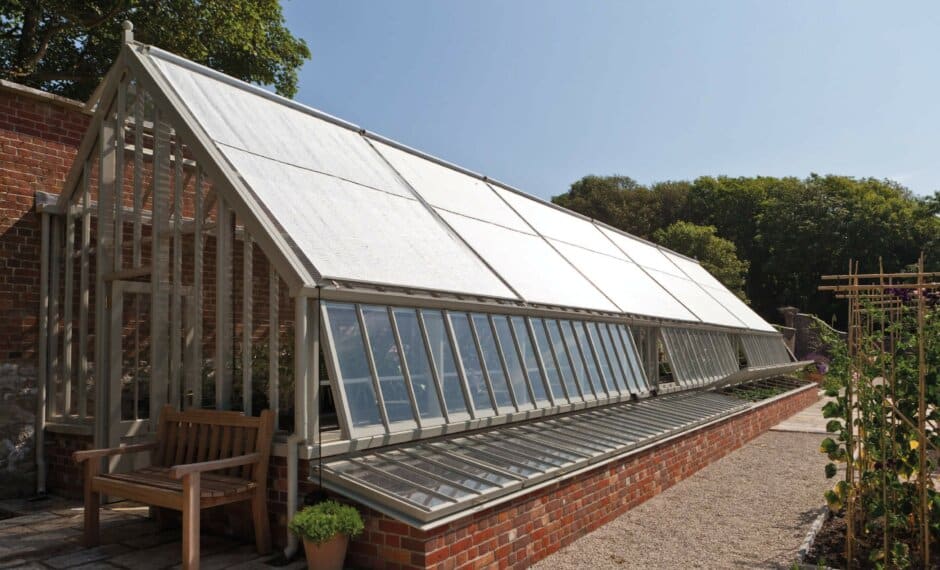 Greenhouse External Roof Shading in the lowered position on a large lean-to victorian greenhouse