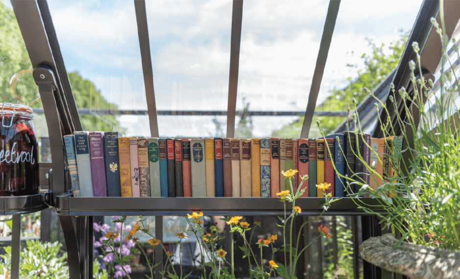 Strawberry Board Shelving containing books inside a Victorian greenhouse