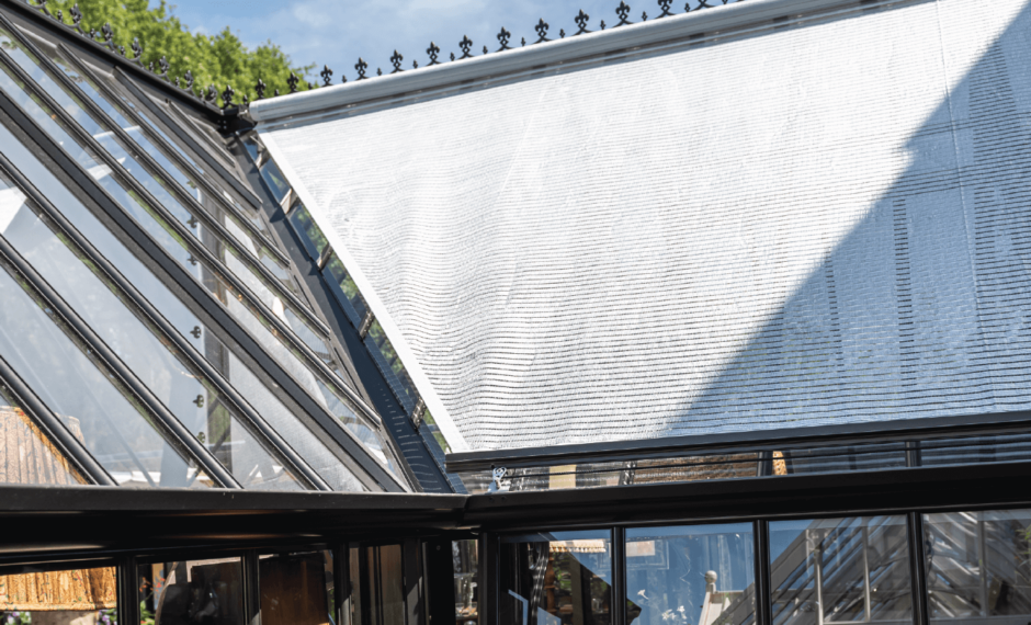 Greenhouse External Roof Shading on one arm of a cruciform shaped greenhouse in the lowered position