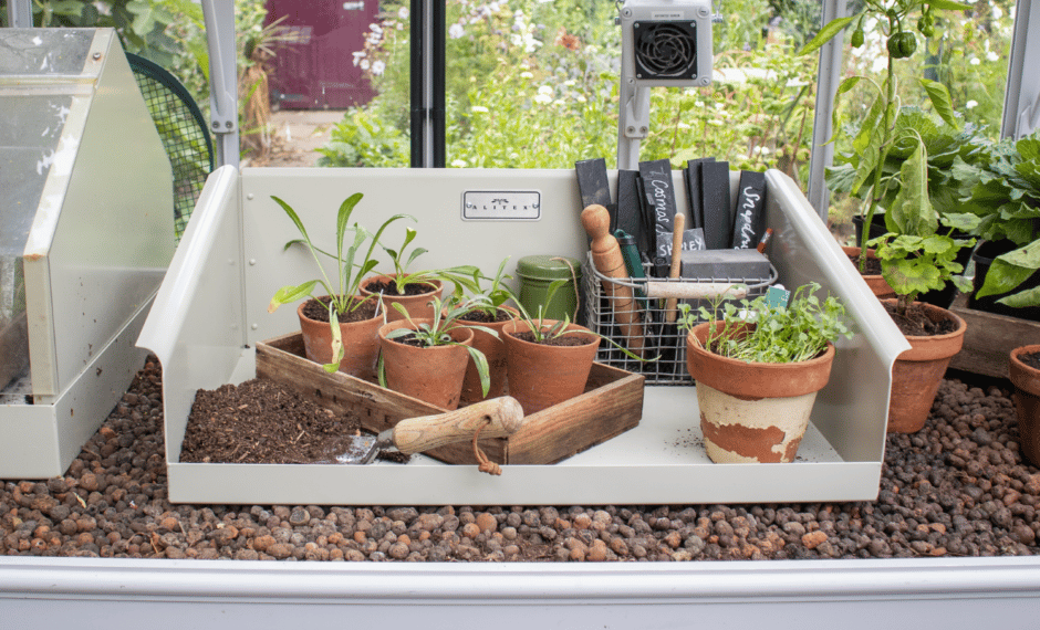 aluminium Potting Shoe on benching with pots, soil and tools inside