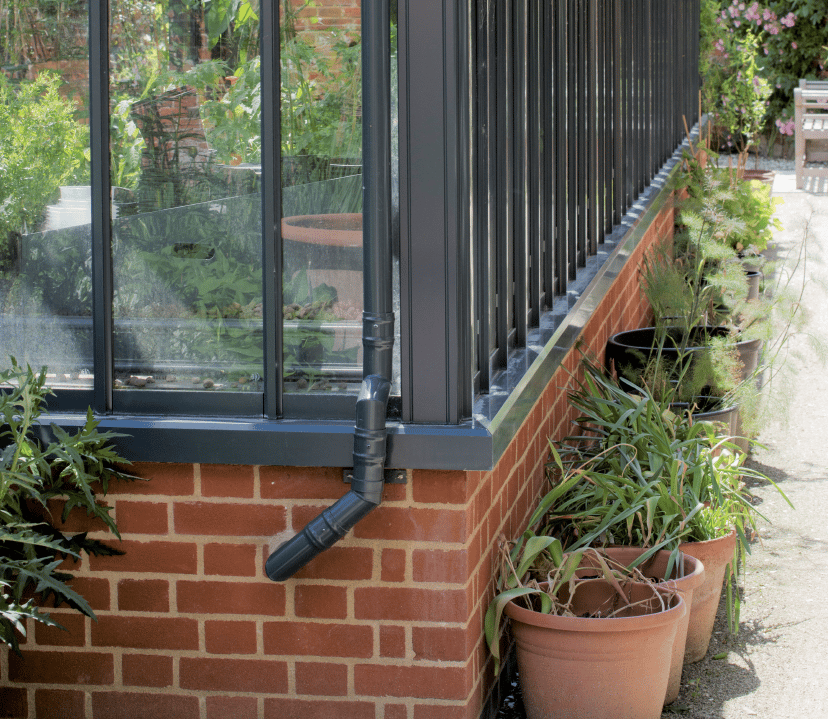 Alitex greenhouse on a brick base