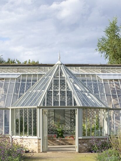 Outside view of the Ramsey Abbey walled garden greenhouse