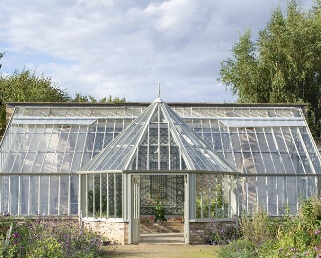 Outside view of the Ramsey Abbey walled garden greenhouse