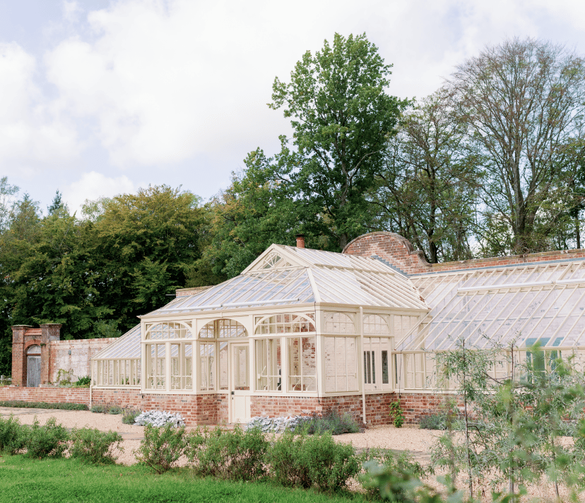Large bespoke Lean-to greenhouse with central lobby