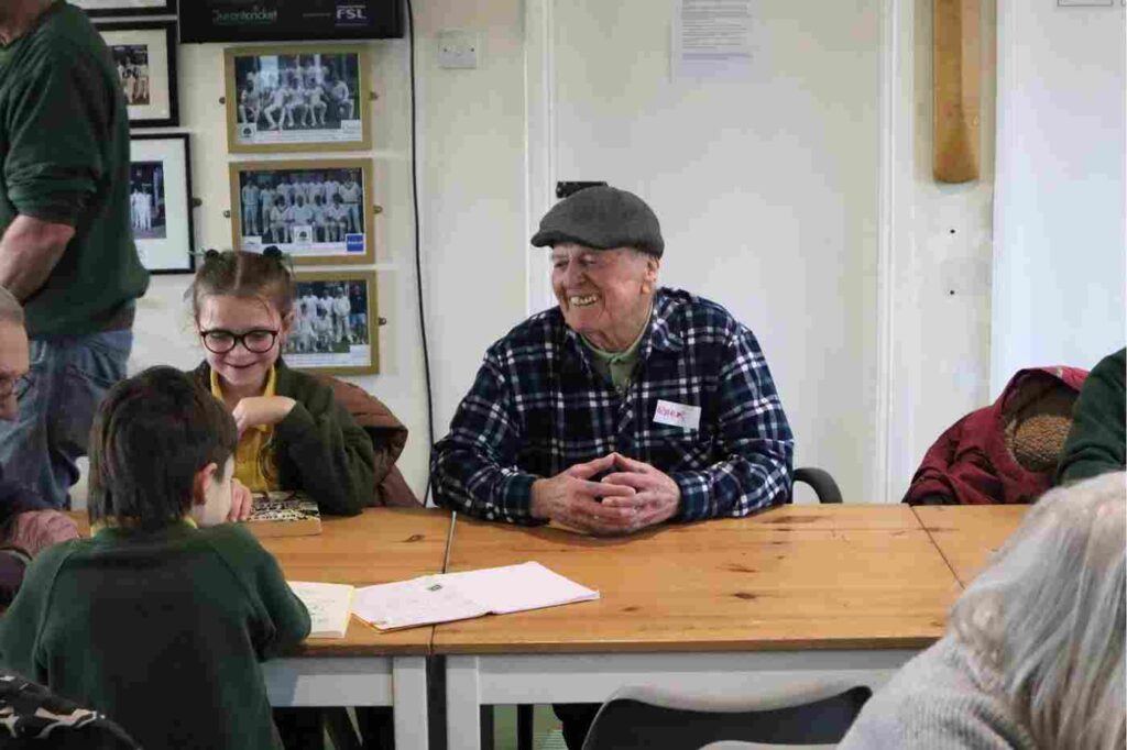 Members of the Young at Heart Heathfield community group and local schoolchildren gather for an activity session at Heathfield Cricket Club, where the Alitex team visited to learn about the charity's inspiring work.